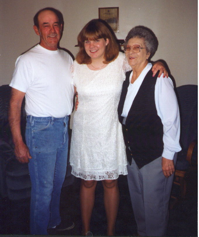 Dad, Me, and Grandma Schneider on the night of my First Communion, 4/99