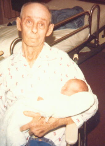 Grandpa Schneider holding me